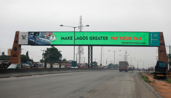 A sign advertising tax payment instructions on a billboard on the Lagos-Ibadan expressway, 2017 (Reuters/Akintunde Akinleye)
