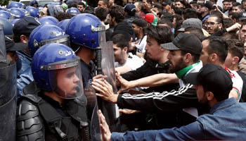 Demonstrators and police confront each other during anti government protests in Algiers, Algeria, April 23 (Reuters/Ramzi Boudina)