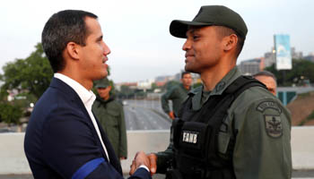 Opposition leader Juan Guaido with an unidentified military officer (Reuters/Carlos Garcia Rawlins)