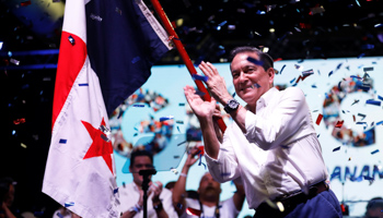 Presidential candidate Laurentino Cortizo of the Democratic Revolutionary Party celebrates next to a Panama flag after Panama's electoral tribunal declared him as the winner of Sunday's election (Reuters/Jose Cabezas)