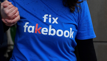 A campaigner from a political pressure group protests as founder and CEO of Facebook Mark Zuckerberg failed to attend a meeting on fake news held by Parliament's Digital, Culture Media and Sport committee in London November 27, 2018. (Reuters/Toby Melville)