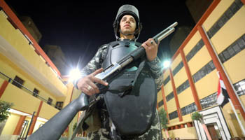 An Egyptian police officer stands guard at a polling station, April 2019 (Reuters/Mohamed Abd El Ghany)