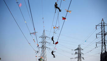 Kites tangled up in electric power cables in India (Reuters/Amit Dave)
