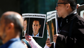 Protesters calling for China to release Canadian detainees Michael Spavor and Michael Kovrig during a court appearance by Huawei's Financial Chief Meng Wanzhou in Vancouver, Canada (Reuters/Lindsey Wasson)