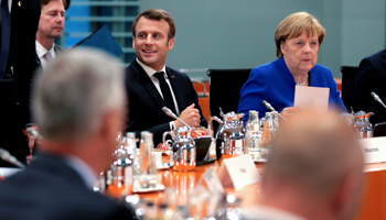 French President Emmanuel Macron and German Chancellor Angela Merkel open the Western Balkans leaders meeting in Berlin, April 29 (Reuters/Michael Sohn)