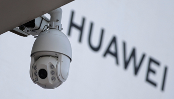 A surveillance camera next to a sign of Huawei outside a shopping mall in Beijing, China, January 29 (Reuters/Jason Lee)