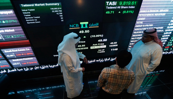 Investors monitor screens displaying stock information at the Tadawul exchange, November 2014 (Reuters/Faisal Al Nasser)