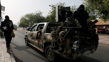 A military vehicle drives along a road in Maiduguri, February 15 (Reuters/Afolabi Sotunde)