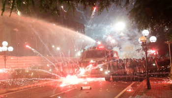 Anti-government supporters throw flares at police during a protest in Tirana, June 2 (Reuters/Florion Goga)