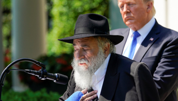 Rabbi Yisroel Goldstein speaks as U.S. President Donald Trump looks on in the Rose Garden at the White House in Washington, U.S., May 2 (Reuters/Kevin Lamarque)