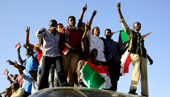 Sudanese demonstrators ride atop a train from Atbara, the birthplace of an uprising that toppled Sudanese former President Omar al-Bashir, in Khartoum, Sudan (Reuters/Mohamed Nureldin Abdallah)