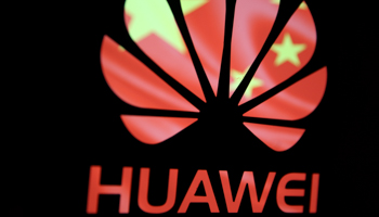 A 3-D printed Huawei logo is seen in front of displayed flag of China in this illustration, taken February 12, 2019 (Reuters/Dado Ruvic)