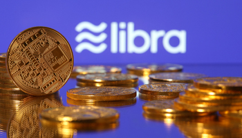 Representations of virtual currency are displayed in front of the Libra logo in this illustration picture, June 21, 2019 (Reuters/Dado Ruvic)