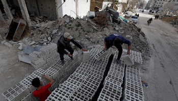 Workers work at a construction site in Ein Terma, a district of eastern Ghouta, Syria February 26, 2019. Picture taken February 26, 2019. (Reuters/Omar Sanadiki)