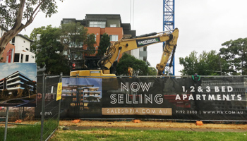 An excavator outside a construction site in Sydney, Australia. (Reuters/Tom Westbrook)