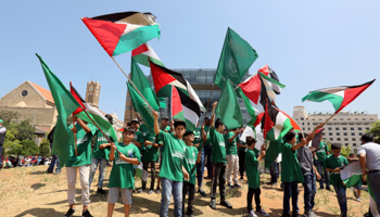 Demonstrators hold Palestinian flags as they protest against the Bahrain conference in front of UN headquarters in Beirut, Lebanon, June 25 (Reuters/Aziz Taher)