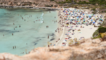 Conigli Island beach on the Sicilian island of Lampedusa, Italy, June 24 (Reuters/Guglielmo Mangiapane)