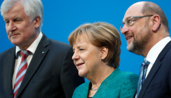 Christian Democratic Union (CDU) leader and German Chancellor Angela Merkel, Christian Social Union (CSU) leader Horst Seehofer and Social Democratic Party (SPD) leader Martin Schulz in Berlin, Germany, February 7, 2018 (Reuters/Hannibal Hanschke)