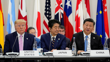 Japan's Prime Minister Shinzo Abe with US President Donald Trump and China's President Xi Jinping during G20 leaders summit in Osaka, Japan (Reuters/Kevin Lamarque)