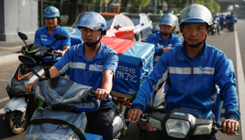 Food delivery drivers in Beijing (Reuters/Thomas Peter)