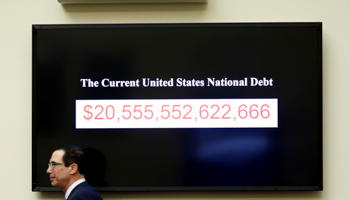Treasury Secretary Steven Mnuchin walks past a  display of the US national debt as he testifies to the House Financial Services Committee on "The Annual Report of the Financial Stability Oversight Council", on Capitol Hill in Washington, February 6, 2018 (Reuters/Joshua Roberts)