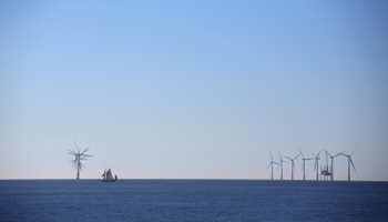 A boat passes a wind farm in Clacton-on-Sea, a town in eastern England (Reuters/Neil Hall)