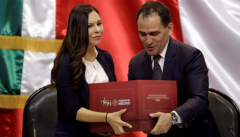 Mexico's Finance Minister Arturo Herrera presents the 2020 national budget to Laura Angelica Rojas president of the Lower House of Congress at the Congress building in Mexico City, Mexico (Reuters/Luis Cortes)