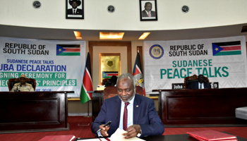 Gibril Ibrahim, chairman of the Justice and Equality Movement, signs an agreement on a roadmap for peace talks, Juba, South Sudan, September 11 (Reuters/Jok Solomun)