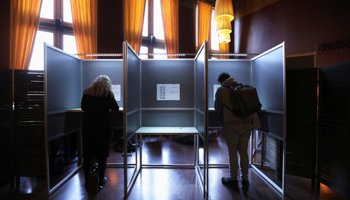 Dutch voters fill in their ballots for the European elections in polling booths at the Central Station in Amsterdam, May 23 (Reuters/Eva Plevier)