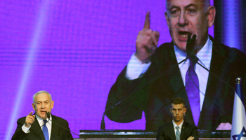 Prime Minister Binyamin Netanyahu speaks at a Likud party event following the general election (Reuters/Ammar Awad)