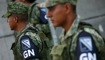 National Guards stand at a checkpoint on the motorway in Tapachula, in Chiapas, Mexico, June 19 (Reuters/Carlos Jasso)