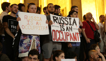 Protesters attend a rally against a Russian lawmaker's visit near the parliament building in Tbilisi, Georgia June 22 (Reuters/Irakli Gedenidze)