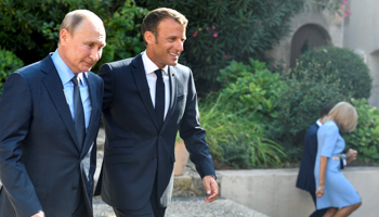 French President Emmanuel Macron welcomes Russia's President Vladimir Putin, near the village of Bormes-les-Mimosas, southern France, on August 19 (Reuters/Gerard Julien)