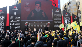 Hezbollah leader Hassan Nasrallah gives a video address to supporters at a religious ceremony in Beirut, September 10 (Reuters/Aziz Taher)