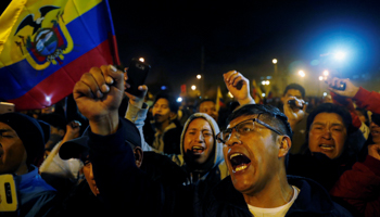 People celebrate on the street after the government of Ecuadorian President Lenin Moreno agreed to repeal a decree that ended fuel subsidies in Quito, Ecuador October 13 (Reuters/Carlos Garcia Rawlins)
