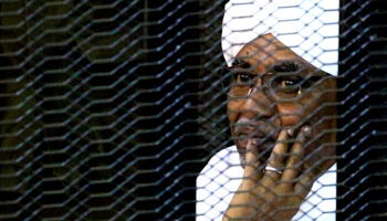 Former President Omar al-Bashir sits in a cage during his trial on corruption charges, September 28 (Reuters/Mohamed Nureldin Abdallah)