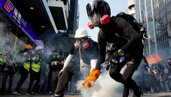 An anti-government protester holds a tear gas canister during a protest in Hong Kong, China October 20 (Reuters/Tyrone Siu)