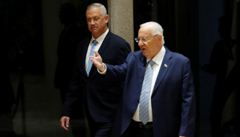 President Reuven Rivlin receives Benny Gantz to mandate him with forming a government, October 23 (Reuters/Ronen Zvulun)