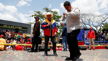 President Nicolas Maduro dances at a rally with supporters (Reuters/Carlos Garcia Rawlins)