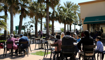 Families having breakfast at a cafe in Tripoli, Libya, April 12 (Reuters/Ahmed Jadallah)