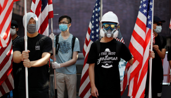 Anti-government protesters hold US flags during a rally at the University of Hong Kong, September 20 (Reuters/Jorge Silva)