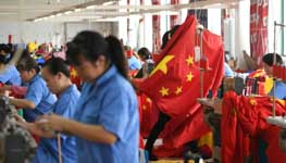 Workers make Chinese flags at a factory in Zhejiang province (Reuters/Stringer)