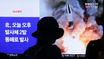 People in South Korea watch a news report on North Korea firing two projectiles into the sea, October 2019 (Reuters/Heo Ran)