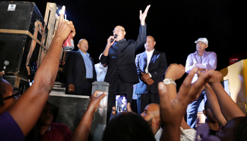 President Desi Bouterse greets supporters following his murder conviction (Reuters/Ranu Abhelakh)