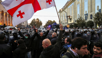 Riot police move in on a November 18 demonstration in Tbilisi (Reuters/Irakli Gedenidze)