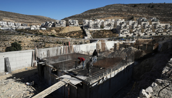 Labourers work on the construction site of the Ramat Givat Zeev settlement in the West Bank, November 19 (Reuters/Ammar Awad)