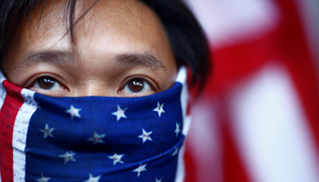 A protester wearing a U.S. flag over his face attends a "March of Gratitude to the US" event in Hong Kong, December 1 (Reuters/Thomas Peter)