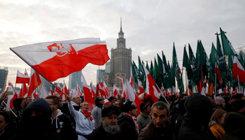 Marchers carry Polish flags on the 101st anniversary of Polish independence, Warsaw, November 11 (Reuters/Kacper Pempel)