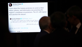 A tweet is projected on screens before remarks from US Secretary of State Mike Pompeo on human rights in Iran, Washington, December 19 (Reuters/Erin Scott)