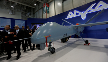 Turkish officials inspect an Anka drone at the defence industry fair in Istanbul, May 2017 (Reuters/Murad Sezer)